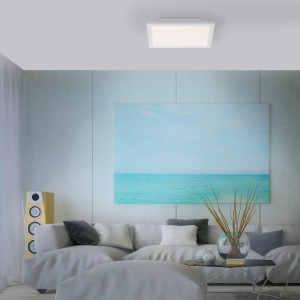 Fehér Just Light LED panel Fleet 29,5x29,5 cm a nappali mennyezetén.