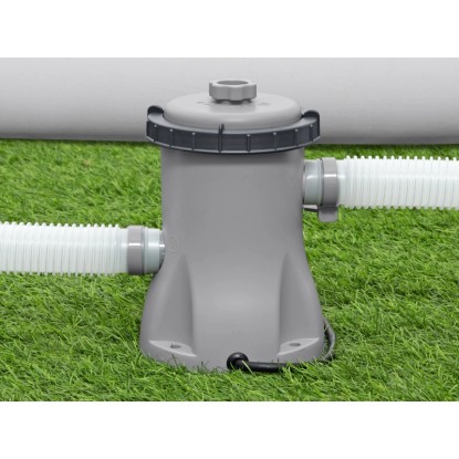 Bestway Flowclear szűrőszivattyú 1249 l/h medencékhez, tömlőkkel a füvön.