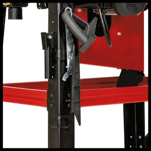 Közelkép az Einhell TC-TS 315 U asztali körfűrészről, szerszámtárolóval az alvázon.