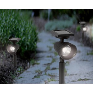 LED-es Travi szolár spotlámpa kerti útvonalvilágításként, földnyárssal és napelem panellel.