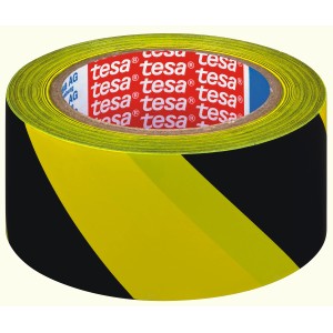 Sárga-fekete t.b.t. figyelmeztető ragasztószalag a tesától tekercsen.